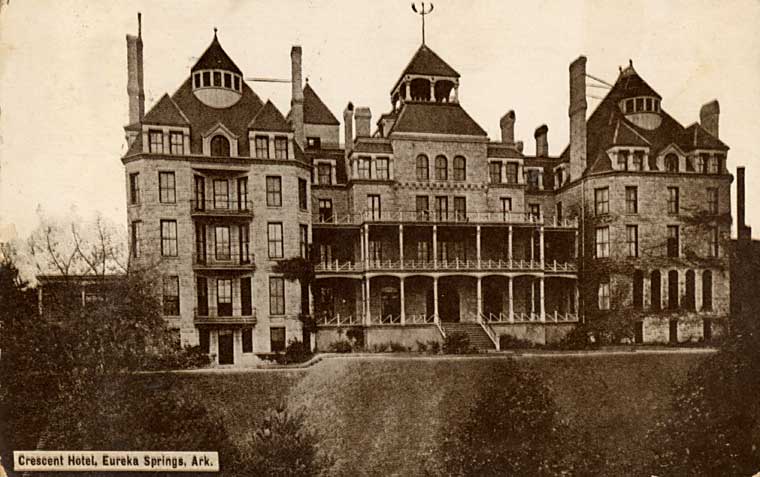 A large multi-story Victorian stone hotel with three towers and wraparound porches, photographed around 1886, with a printed caption reading Crescent Hotel, Eureka Springs, Ark.