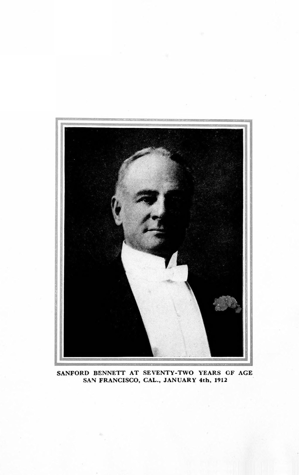 Black-and-white half-length photographic portrait of an older clean-shaven man with full cheeks and combed-back hair, in white tie and dark formal coat.