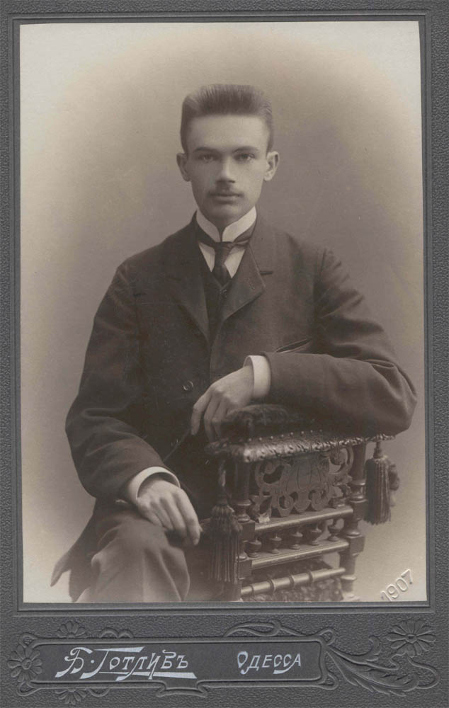 Black-and-white studio portrait of a young Alexander Bogomolets in early-twentieth-century formal dress, seated, facing slightly to the side.