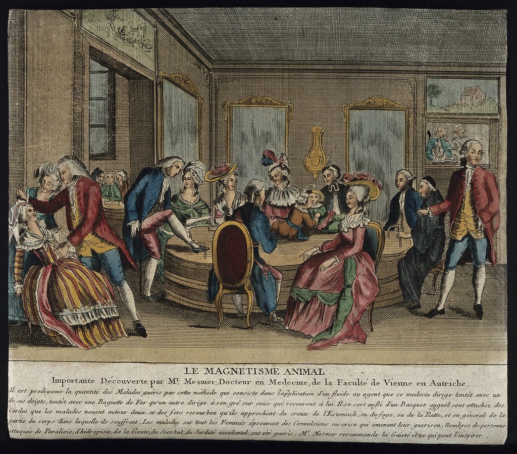 A group of patients seated and standing around Mesmer's baquet in a Parisian salon