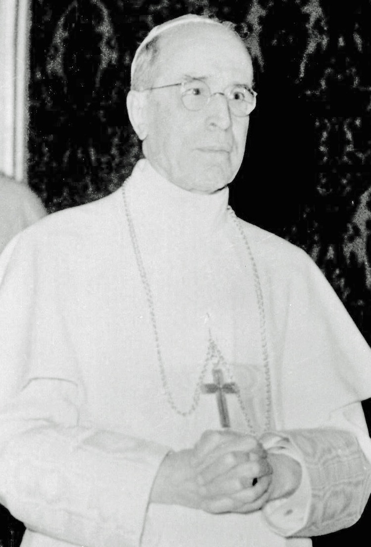 Portrait photograph of Pope Pius XII in white papal vestments, 1958.